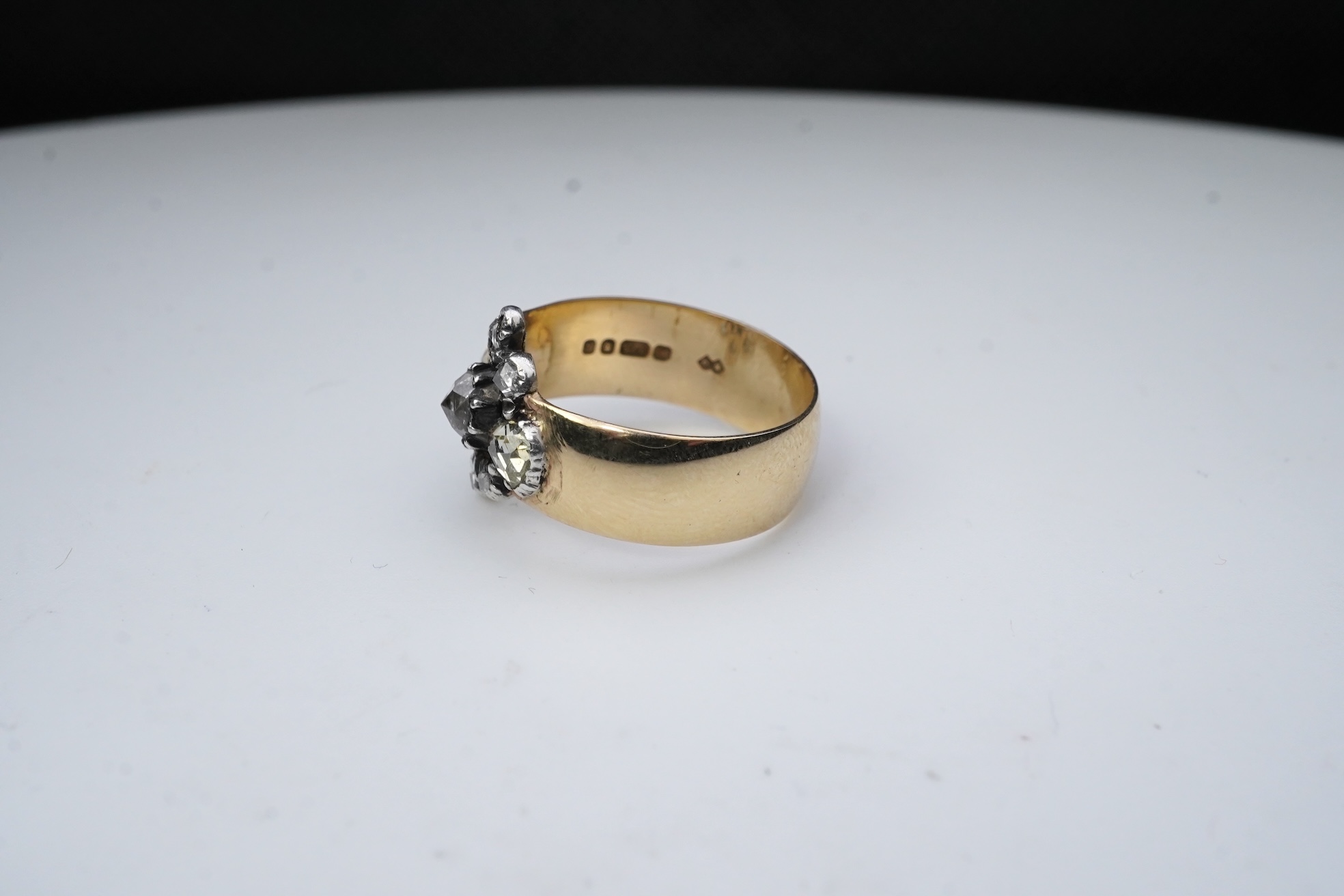 A gold and diamond ring